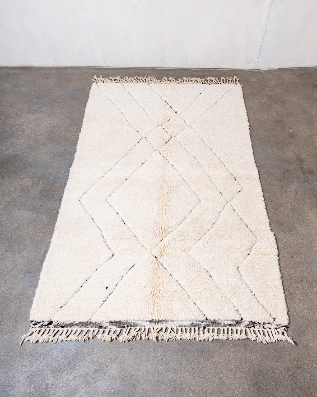 Modern, designer, handcrafted Berber rug from Morocco. Beniourain carpet with minimalist design, natural wool pile and a fluffy texture.